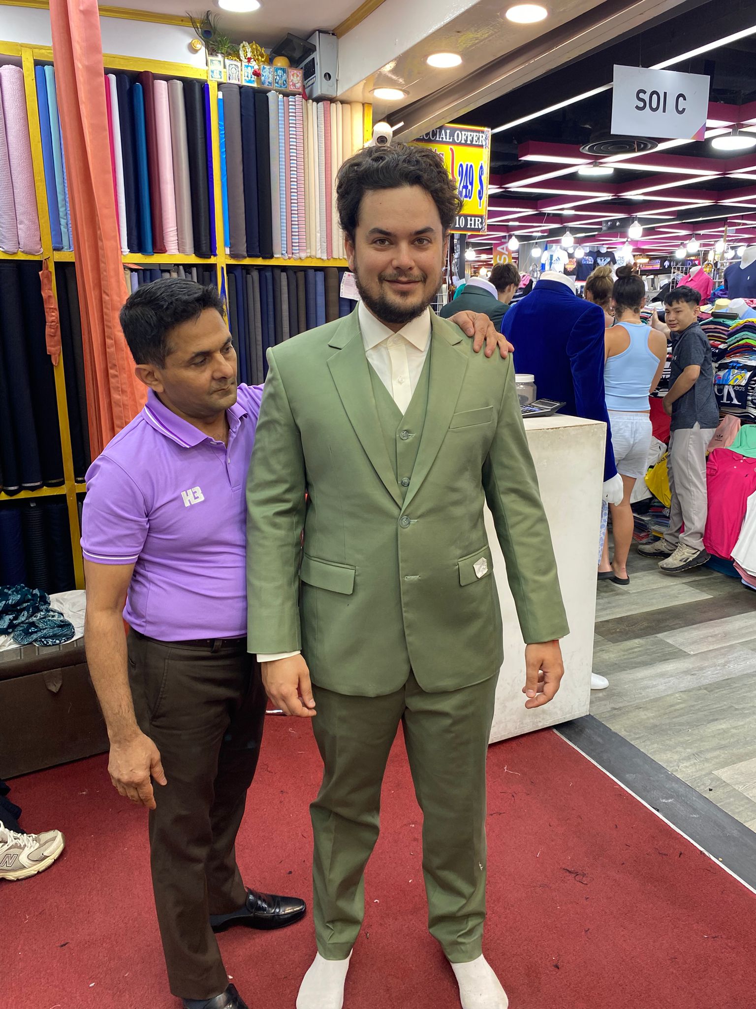 Happy client in custom tailored suit at King Fashion Uni Bangkok